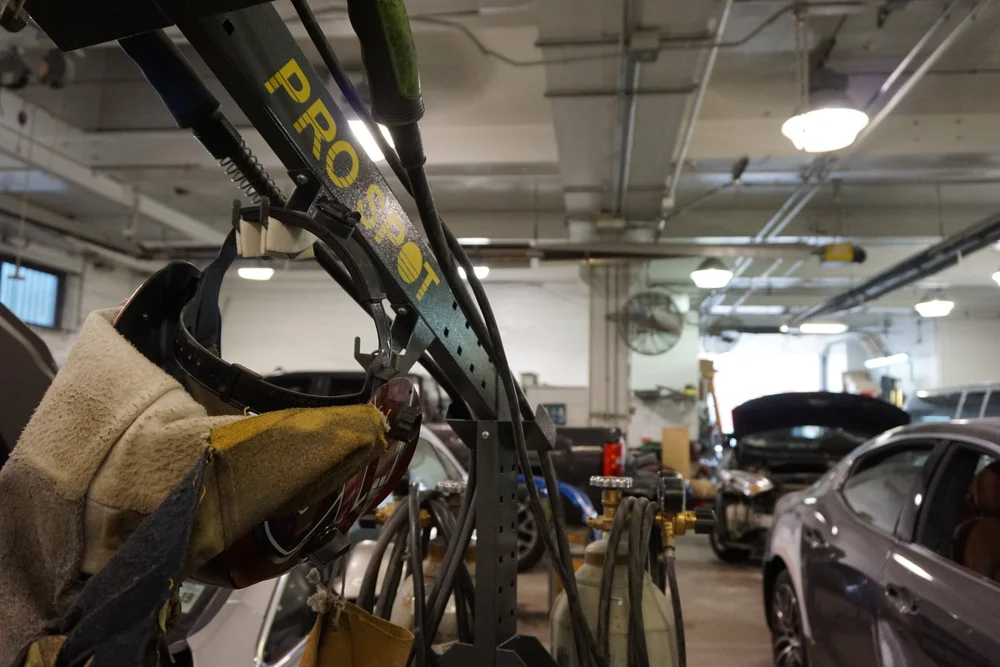 Pro-Spot welding equipment on the body shop floor at Autoshow Collision Center on Reed Street